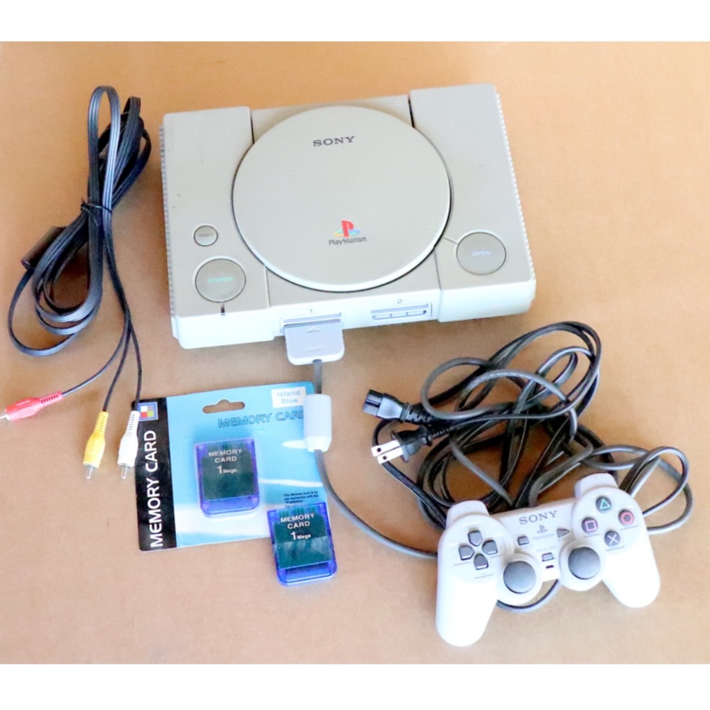 Original Sony Playstation PS1 console + Dual Shock controller + memory cards